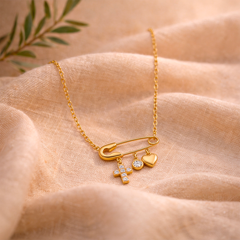 Collier croix épingle dorée
