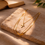 Collier multirang croix dorée