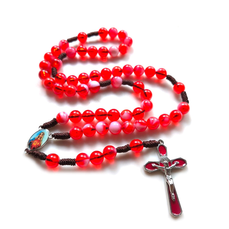 Chapelet perles rouges sur cordon